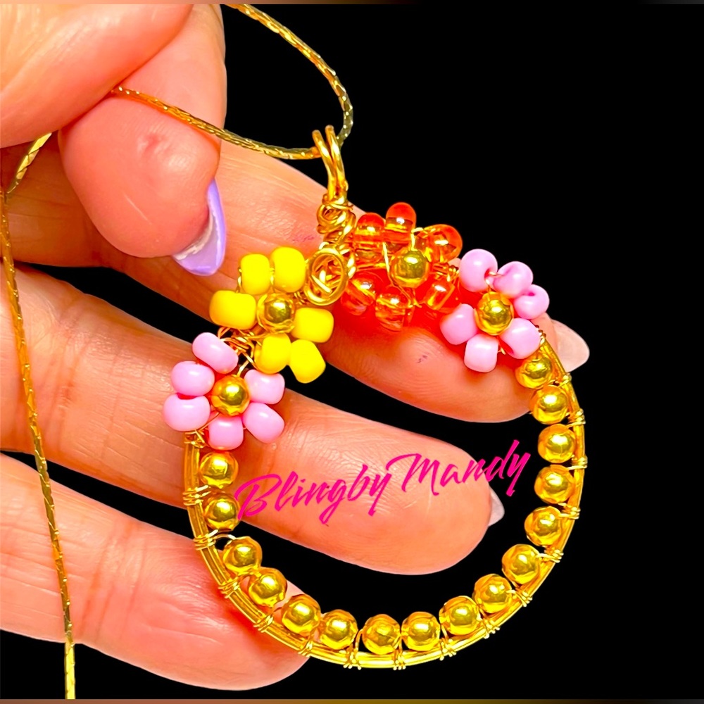 Large round beaded pendant -flower and sunshine colors